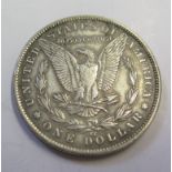 An American Morgan type dollar coin, dated 1891, 26.7g, possibly later