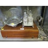 A glass cruet on stand, a plated bird, a swinging handle basket, etc