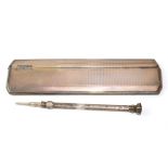 A silver Edwardian pencil and a silver cased comb
