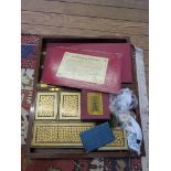 A Victorian inlaid mahogany games compendium, the hinged box with chess and backgammon inlay