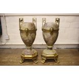 A pair of large gilt metal and marble garniture vases, of Regency style, the turned marble vases