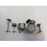 A five piece silver miniature drum kit