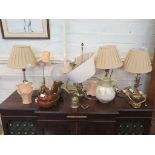 A wall mounted brass oil lamp, a pair of brass and glass table lamps and various other table