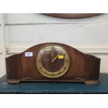 A 1920s oak mantel clock, with silvered dial, the three train movement striking on a gong, 52cm