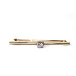 A diamond set bar brooch