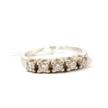 A five stone diamond ring set in white metal (shank broken)