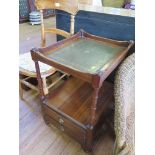 A mahogany whatnot, with leather top over turned supports and two drawers 41cm wide and a