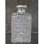 An Asprey silver topped cut glass bottle, London 1883