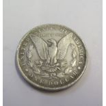 An American Morgan type dollar coin, dated 1884, 26.8g, possibly later