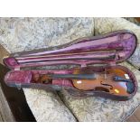 A violin with two piece back, unlabelled, length of back 36cm, and three bows, one stamped Homa D.