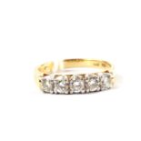 A five stone diamond ring set in 14 carat gold