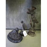 A bronze figure of a boy playing with a cat, on a stone base, 13cm high, another of a piper and a