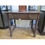 An oak bobbin turned side table, parts possibly 18th century, with rectangular top, frieze drawer