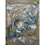 A bag of miscellaneous costume jewellery