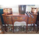 A George III style mahogany and satinwood crossbanded bowfront sideboard, the central drawer flanked