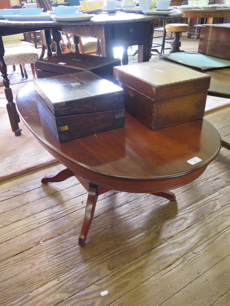 An oak dropleaf coffee table, the oval top on turned and block legs 105cm wide and another