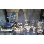 A pair of silver plate candlesticks, eight glass coasters, sauce boats, a monocular and field