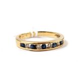 A diamond and sapphire half eternity ring