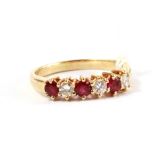 A six stone ruby and diamond ring set in 14 carat gold