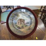 A 19th century painted porcelain plate, depicting figures before Janus's arch, foliate mark and