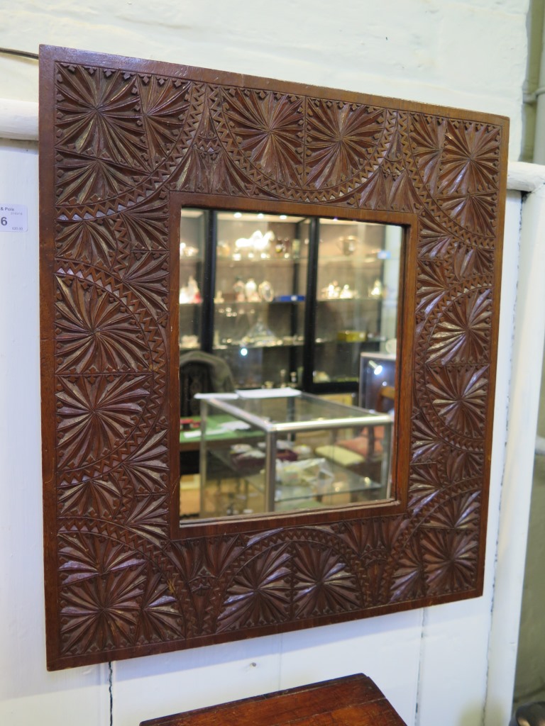 A carved wood mirror 46cm x 41cm