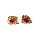 A pair of ruby and diamond earrings