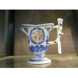 A Chinese late 18th century helmet shaped blue & white cream jug, with additional hand painted