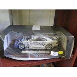 A 1:18 model of an AMG Mercedes CLK in the racing colours of Peter Dumbreck