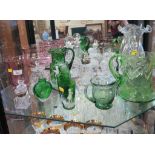 A Victorian green glass Mary Gregory decorated jug and two beakers, a Victorian inkwell and