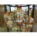 Four Japanese Kutani vases, two as found, and a covered jar with foo dog finial (5)