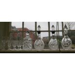A pair of silver collared cut glass decanters, two other decanters, and other glassware