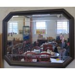 An oak framed octagonal wall mirror 53cm x 68cm