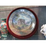 A 19th century painted porcelain plate, depicting figures before Janus's arch, foliate mark and