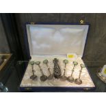 A boxed set of six Persian spoons and sugar grips