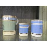 A Victorian Mocha ware mug, 15cm high and two similar pint and half pint mugs with blue banded