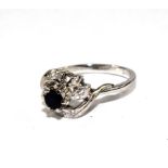 An 18 carat white gold sapphire and diamond ring
