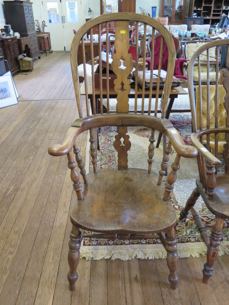 An ash and elm high-back Windsor chair, the splat and spindle back over turned supports and