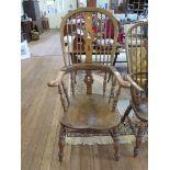 An ash and elm high-back Windsor chair, the splat and spindle back over turned supports and