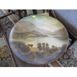 A Victorian painting of Thirlmere on a terracotta plate, 41cm diameter