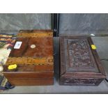 A Chinese hardwood box, the sliding lid carved with dragons, the sides with animals 20.5cm wide, and