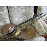 A brass warming pan, a copper warming pan and a copper sieve (3)