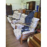 An oak Ercol Saville three piece suite, comprising three seat settee and two armchairs