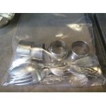 A small collection of silver cutlery and four napkin rings