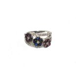 A diamond, sapphire and amethyst ring set in 18 carat white gold