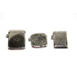 A collection of three silver vesta cases