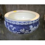 A Chinese blue decorated lipped bowl, four characters, 20cm diameter