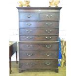 A George III oak chest on chest, the moulded cornice over two short and three long graduated drawers