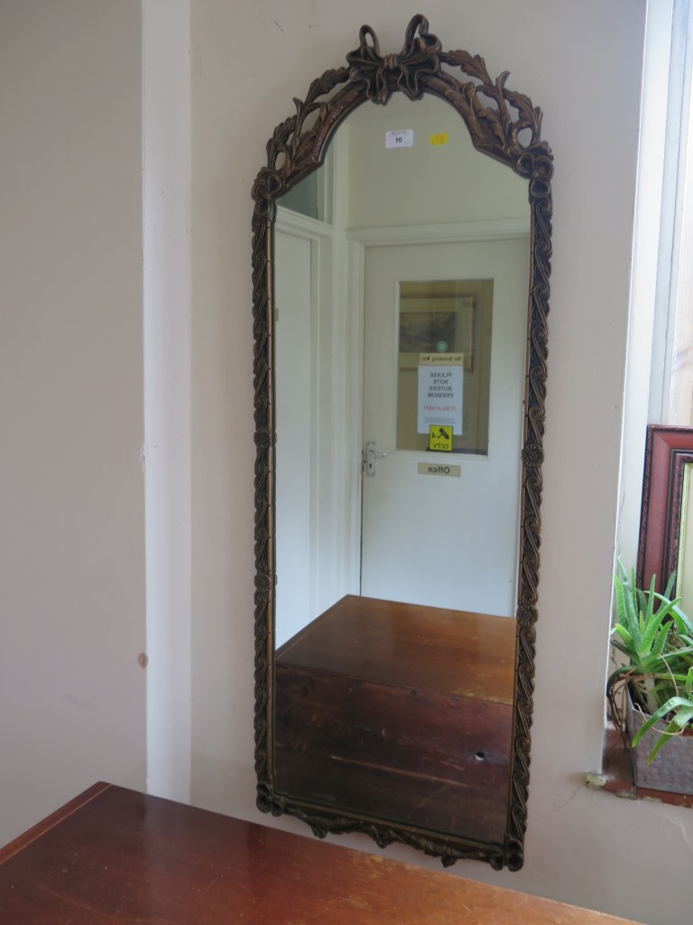 A rectangular bevelled glass wall mirror, with gilt swag frame, 80.5cm x 57.5cm and a long wall