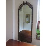 A rectangular bevelled glass wall mirror, with gilt swag frame, 80.5cm x 57.5cm and a long wall