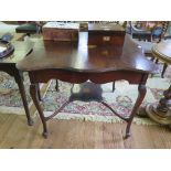 An Edwardian stained beech window table with patera inlay, the shaped square top on cabriole legs